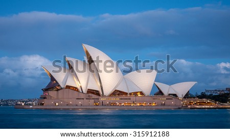 SYDNEY, AUSTRALIA SEPTEMBER 26: Sydney Opera House at dusk with low clouds in the background. Taken on September 26, 2011.
