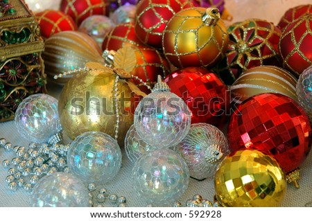 Christmas Tree Ornaments - Dozens of red, white and gold Christmas tree ornaments ready for holiday decorating.