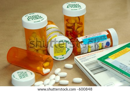 Prescription pills, drug bottles, instructions and warnings.