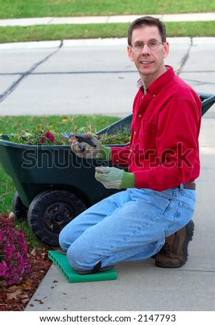 Yard Work - Man doing spring or fall yard work.