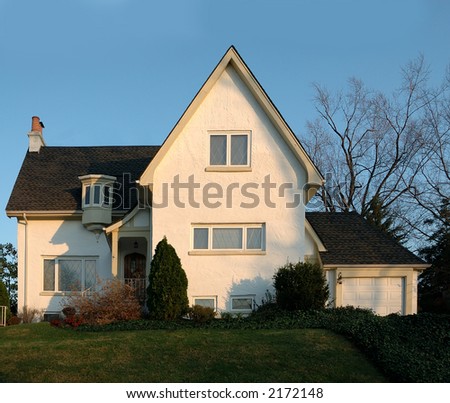 Stucco House in America - A two story white stucco house.