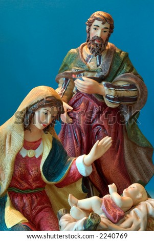 Holy Family - Joseph and Mary admire the baby Jesus.
