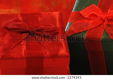 Holiday Gifts - Pretty gifts in fabric covered boxes with gossamer ribbons and bows for a special person.