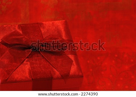 Holiday Gift - A pretty gift in a fabric covered box with gossamer ribbon and bow for a special person.
