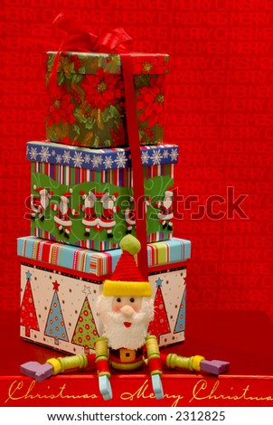 Holiday Gifts - Festive gift boxes and a toy Santa Claus against a cheerful holiday background.