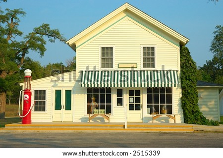 A general store and gas station with an antique gas pump outside that is now simply decorative, no longer in use.