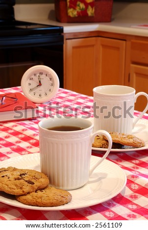Cookies and Coffee Brunch - The table is set with plates of cookies and cups of coffee for a late morning snack.