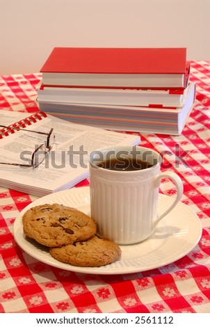 Cookies and Coffee Break Time - The table is set with plates of cookies and cups of coffee for a late morning snack.