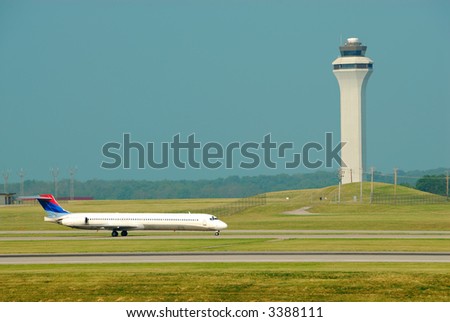 Airplane Landing In Front Of The Control Tower - Cincinnati Northern KY International Airport, CVG