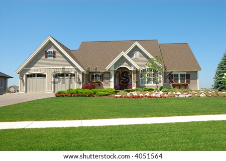 Residential Upscale American House - A residential suburban home in an upscale neighborhood in the summertime.