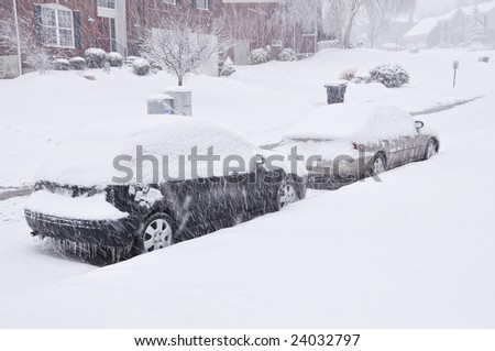 Snow Storm In Kentucky.  Cars covered in snow and ice during a blizzard.