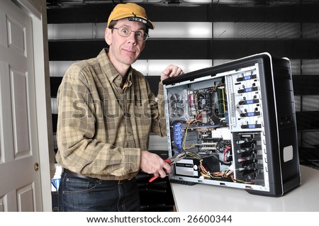 http://image.shutterstock.com/display_pic_with_logo/7096/7096,1236978745,1/stock-photo-wild-eyed-computer-geek-working-on-the-inside-of-a-pc-computer-with-a-screw-driver-26600344.jpg