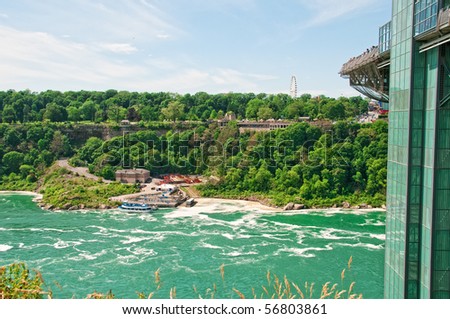 Niagara Falls, Ontario, Canada is seen across the Niagara river where the Maid of the Mist tour boat begins the ride to the base of the falls.