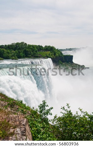 Niagara Falls, New York, USA. Niagara State Park is the oldest state park in the United States.  Across the water is Niagara Falls, Ontario, Canada.
