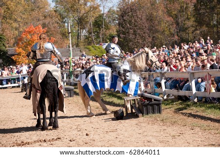 HARVEYSBURG OH-OCT 9:Reigning world champion jousters Shane Adams (L) and Jason Armstrong entertain the crowd before a jousting match at the Ohio Renaissance Festival Oct 9, 2010 in Harveysburg OH