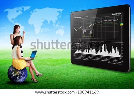Two lady look at the Graph report on tablet computer on grass field : Elements of this image furnished by NASA