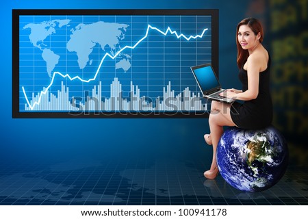 Accountant reporting the Graph on LCD monitor : Elements of this image furnished by NASA