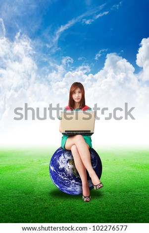 Lady on globe hold notebook computer and look a me : Elements of this image furnished by NASA
