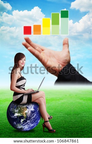 Lady on globe and Graph report on the hand : Elements of this image furnished by NASA