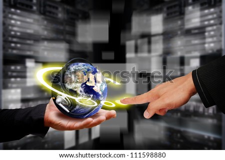 Programmer \'s hand in data center room and control the digital world : Elements of this image furnished by NASA