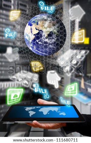 Digital world and the hand take control the system in data center room : Elements of this image furnished by NASA