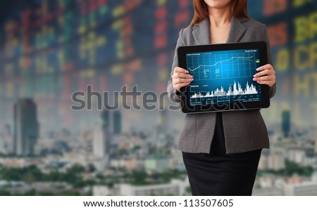 Business woman with stock graph report