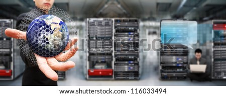 Programmer team in data center room for service : Elements of this image furnished by NASA