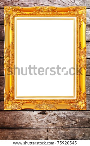 gold modern Antique pattern frame on vintage wooden wall isolated