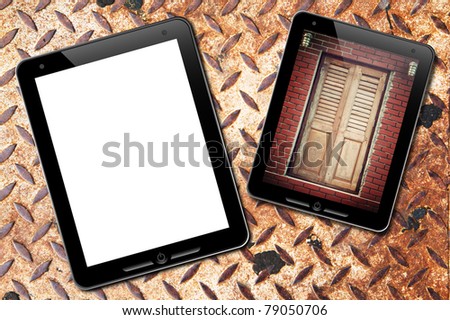touch pad with old door background and : grunge rusty plate