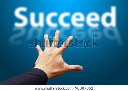 Hand grab the word Succeed