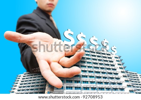 Business man give the hand on building and money icon