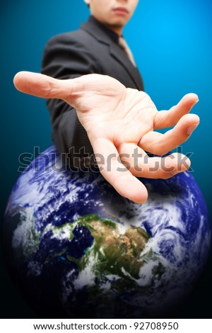 Business man give the hand to Earth