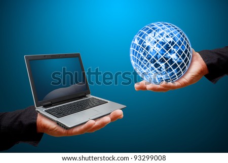 Globe and notebook computer on Smart hand