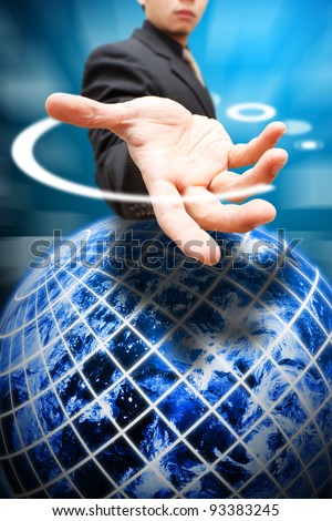 Business man give the hand to globe