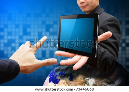 Smile Business man hold tablet computer on globe and hand point