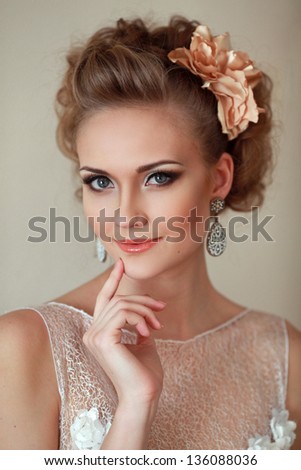 a young girl with a beautiful make-up and with the wedding hairdo