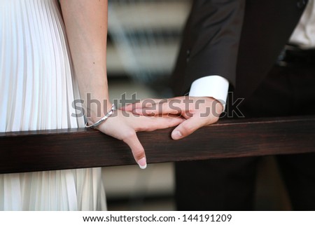 the delicate hands married couples holding each other