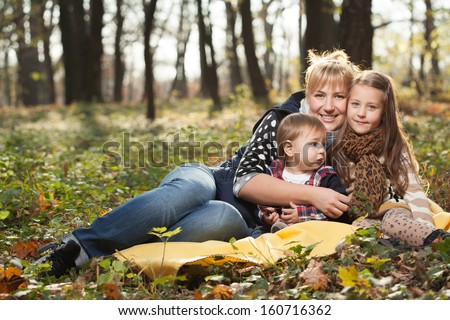 Happy Young Family Portrait with Fall colors