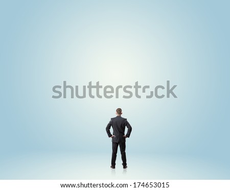 man looking up at empty space