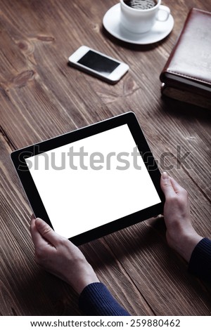 woman shows screen of digital tablet in his hands