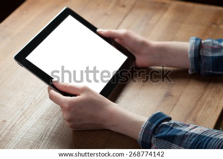 woman shows screen of digital tablet in his hands. Clipping path included.