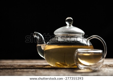 Green tea with jasmine a in a glass teapot