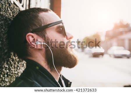 Hipster listening to music portrait