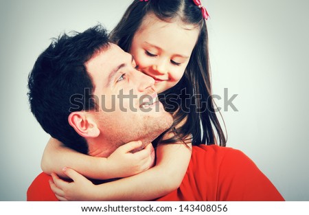 Portrait of a happy father and a beautiful little girl