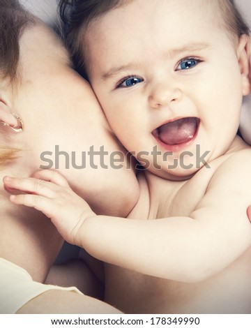 mother kissed her little baby close-up mother kissed her little baby close-up