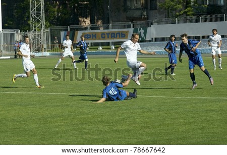 DNEPRODZERZHINSK, UKRAINE - JUNE 4:Czech Vitaly (in white) in action at a 2nd League of National Ukrainian Championship soccer game - Stal vs Olympic on June 4, 2011 in Dneprodzerzhinsk, Ukraine