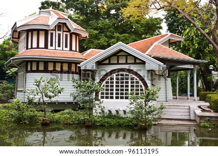 small wooden house near the river