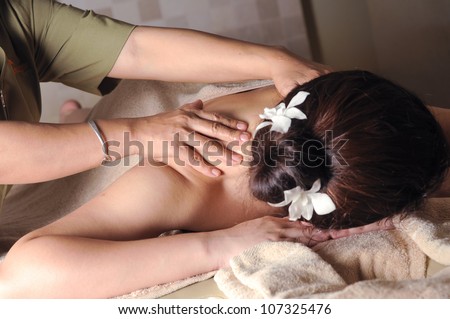 Famous traditional Shiatsu body massaging, part of spa treatment (shallow depth of field)
