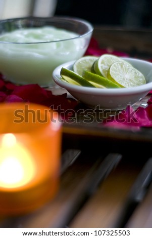 Lime and massaging oil, most important ingredient used in spa treatment (shallow depth of field)