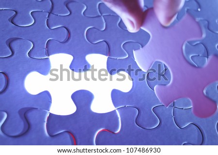 Glowing missing jigsaw puzzle piece, business concept for completing the final puzzle piece